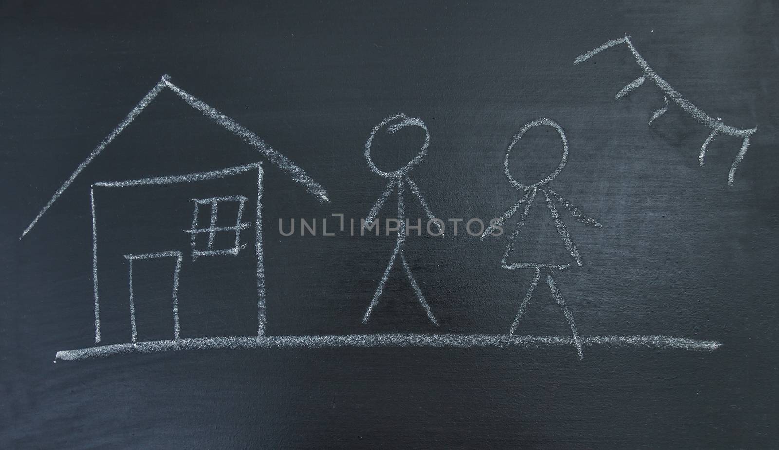 Family, house and sun, painted chalk on a black board