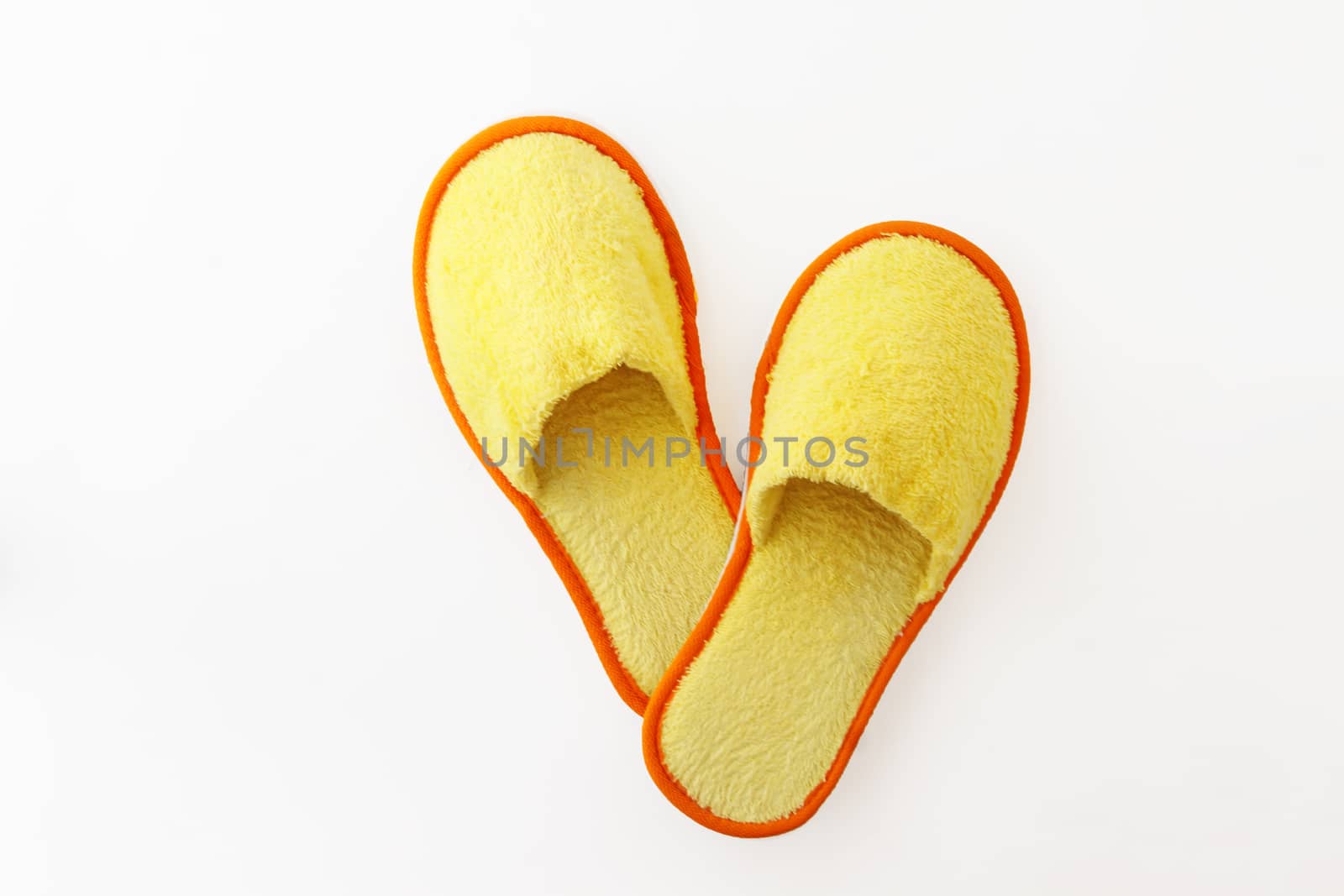 multicolored soft fluffy house slippers isolated on white background.