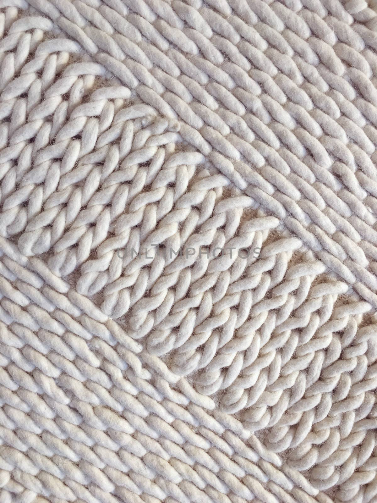 White wool handmade knitted background by anikasalsera