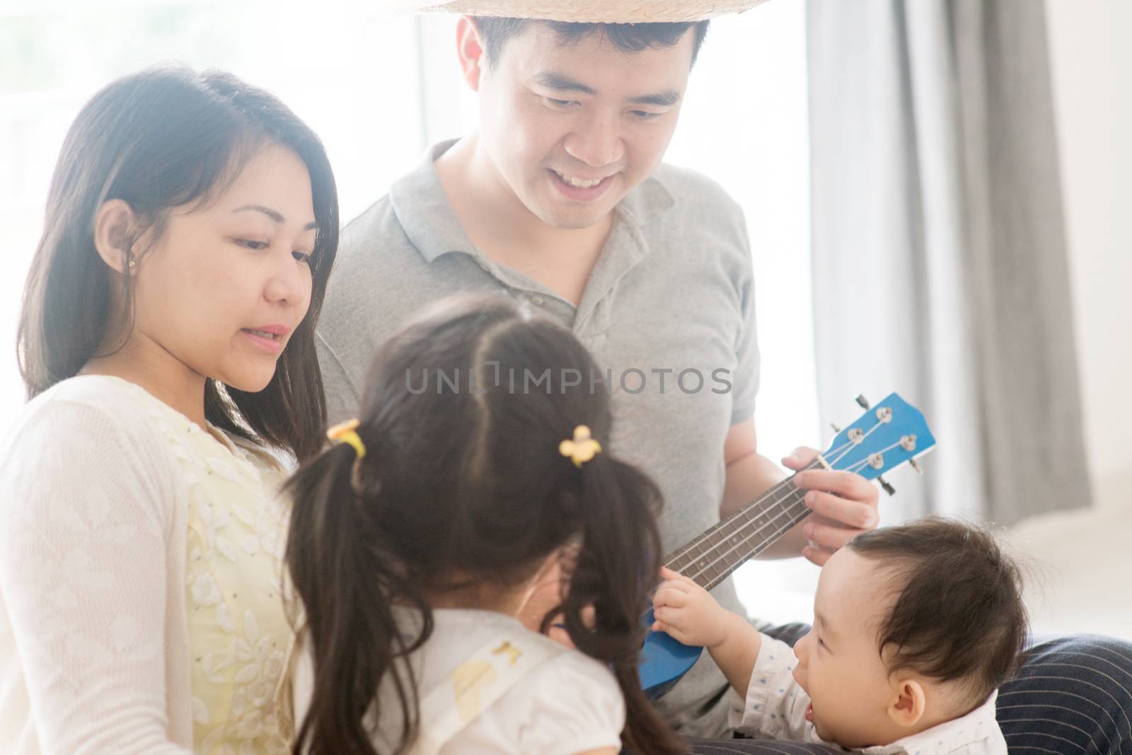 Family playing ukulele  by szefei