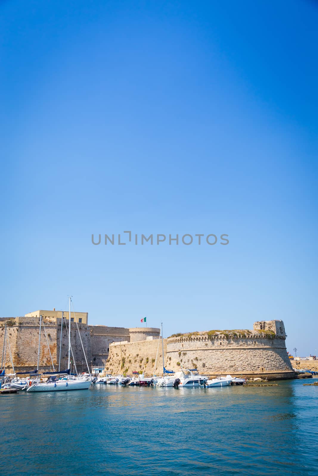 The harbour and the old walls of Gallipoli, Puglia Region - South Italy