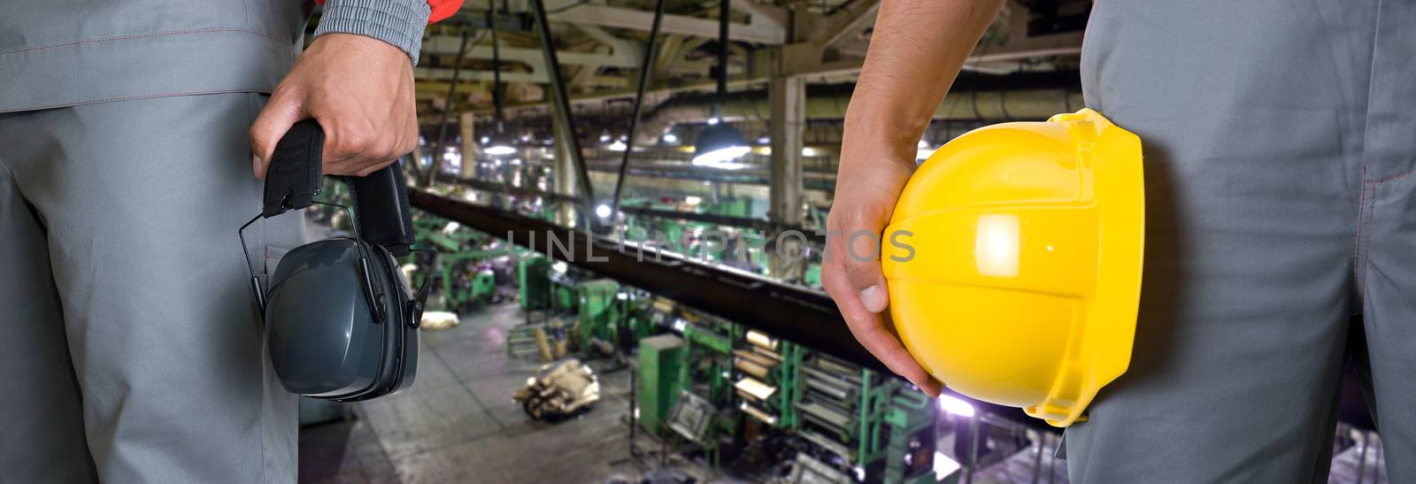 Workers with safety uniform at industrial factory