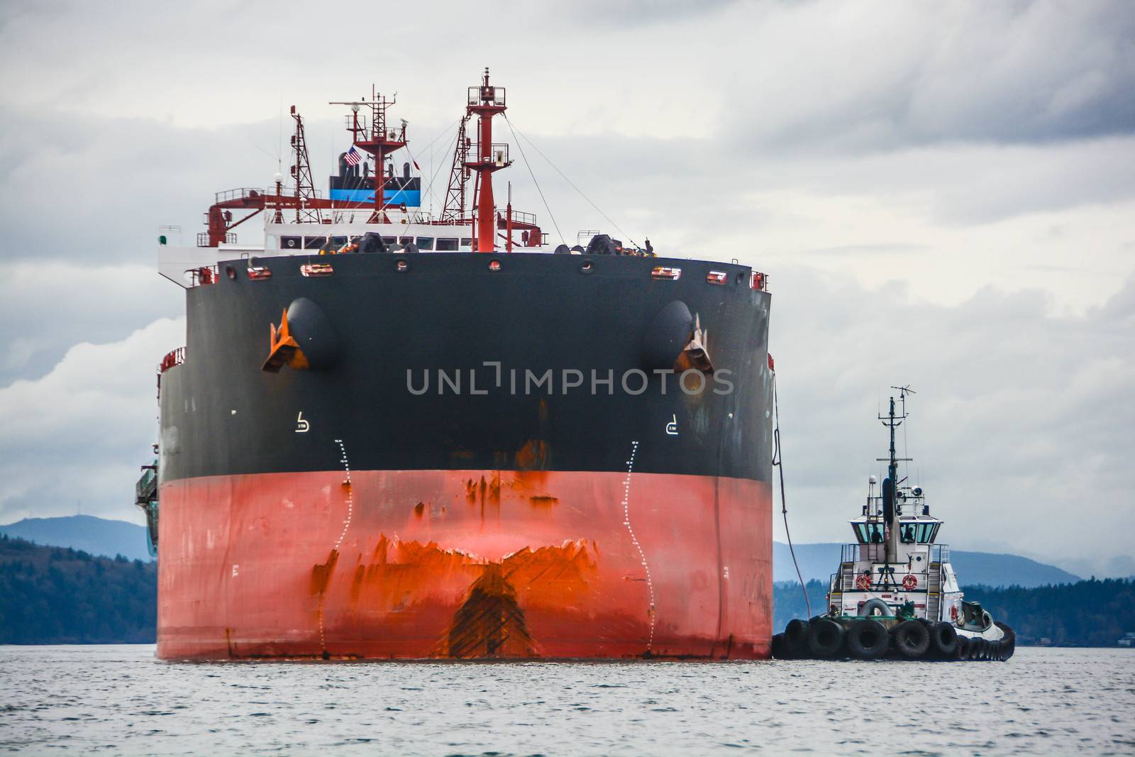 Tug being assisted into Seattle's grain terminal