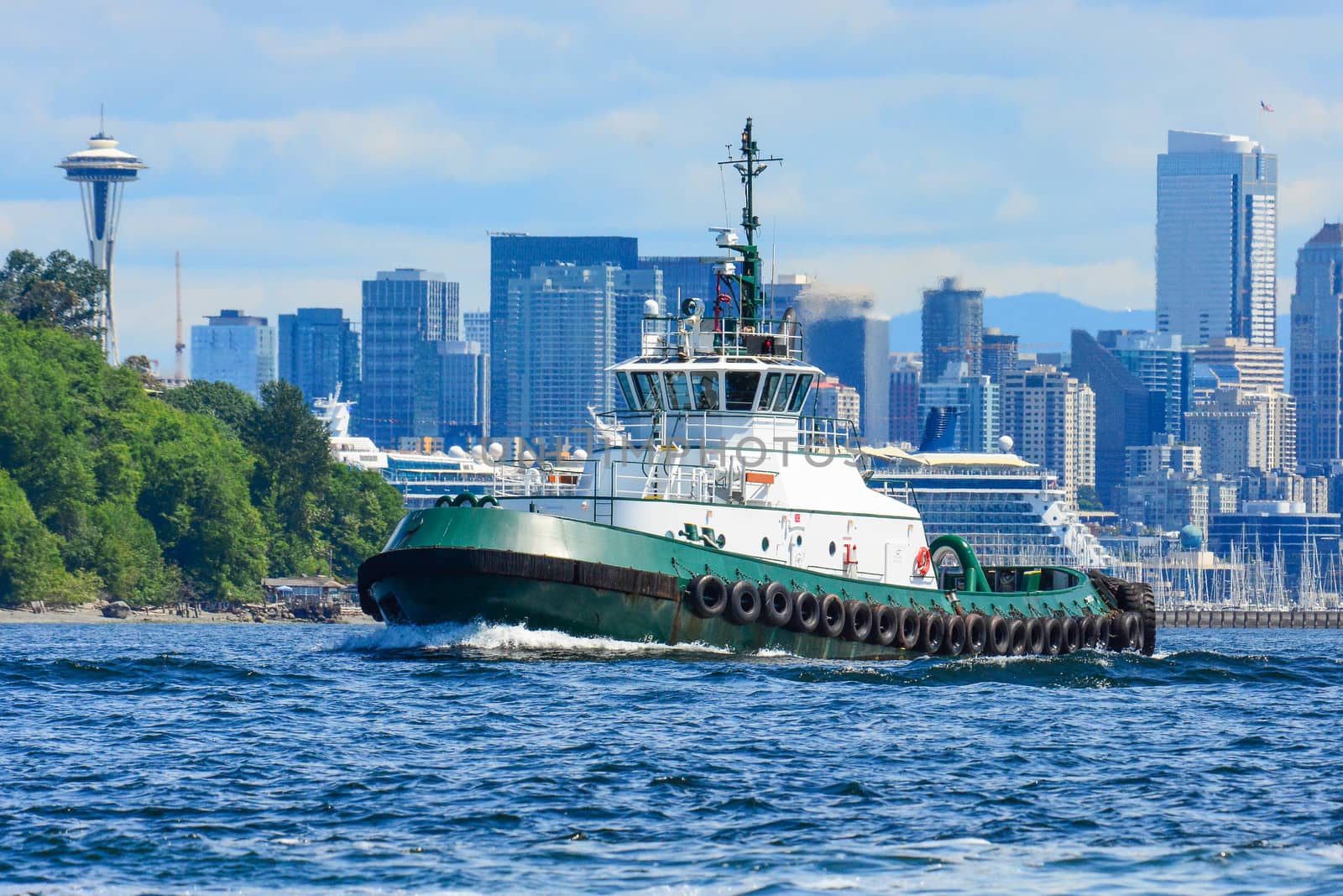 Tug transits Elliott Bay - Seattle, WA