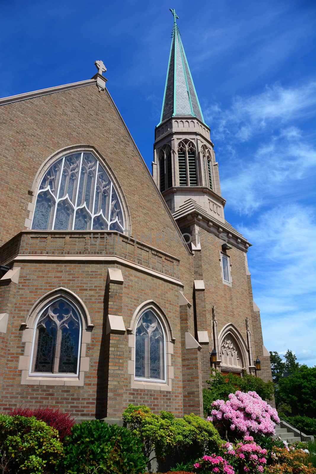 Gothic Church in Bellingham, WA with blue sky and wispy clouds