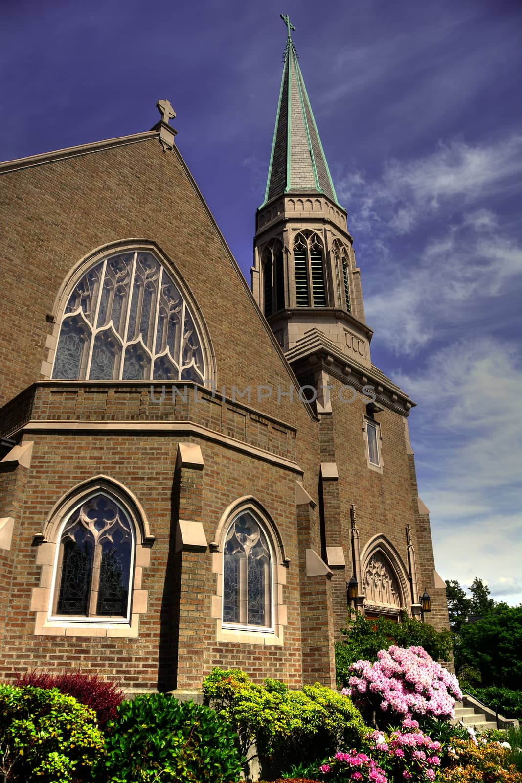 Gothic Church in Bellingham, WA with blue sky and whispy clouds