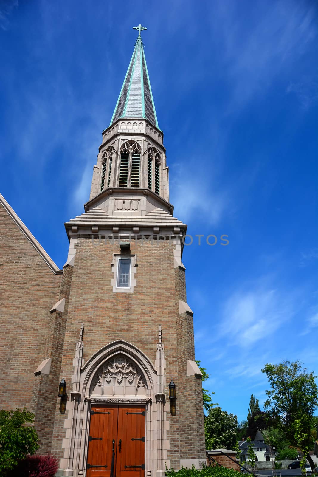 Gothic Church in Bellingham, WA with blue sky and wispy clouds