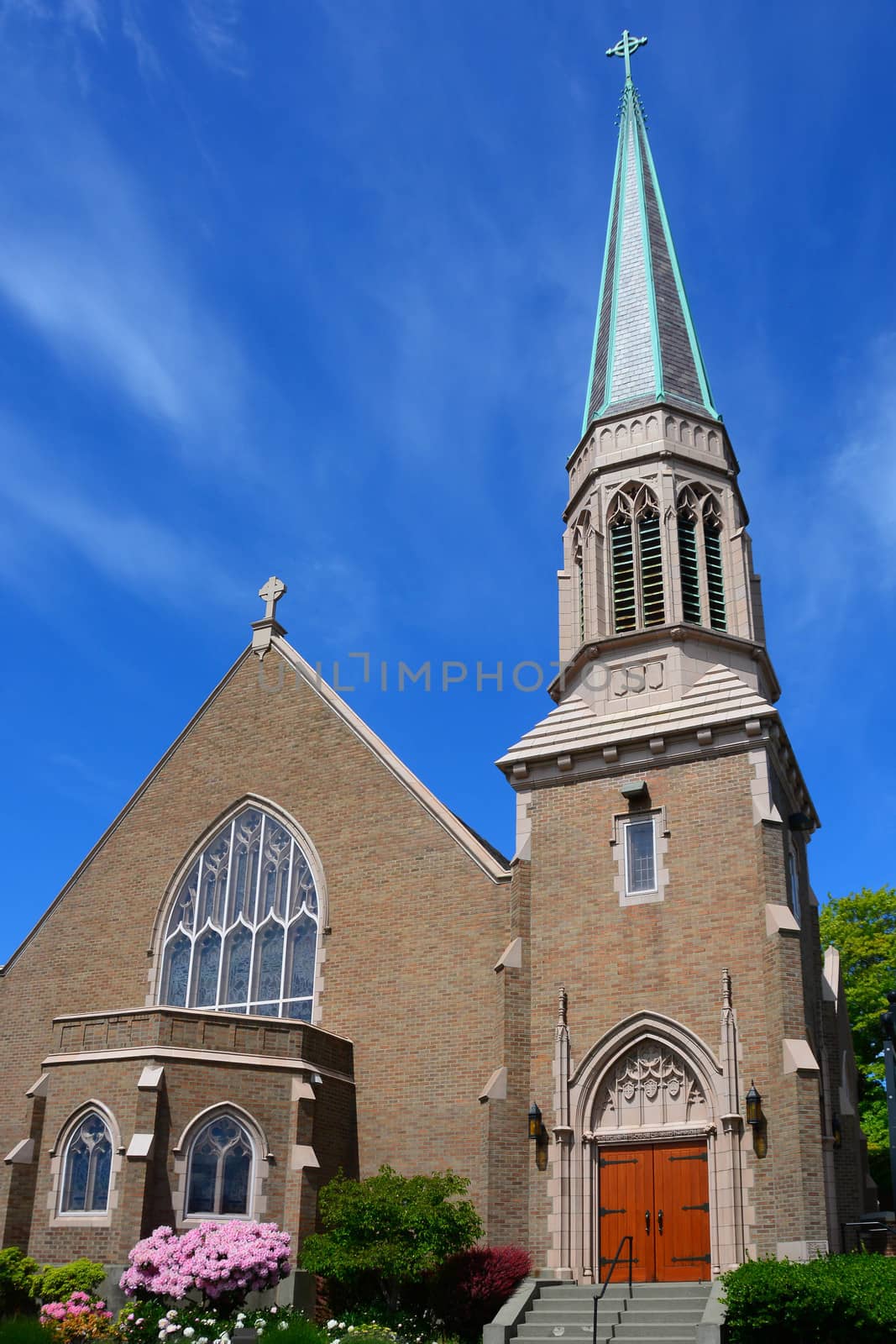 Gothic Church in Bellingham, WA with blue sky and wispy clouds