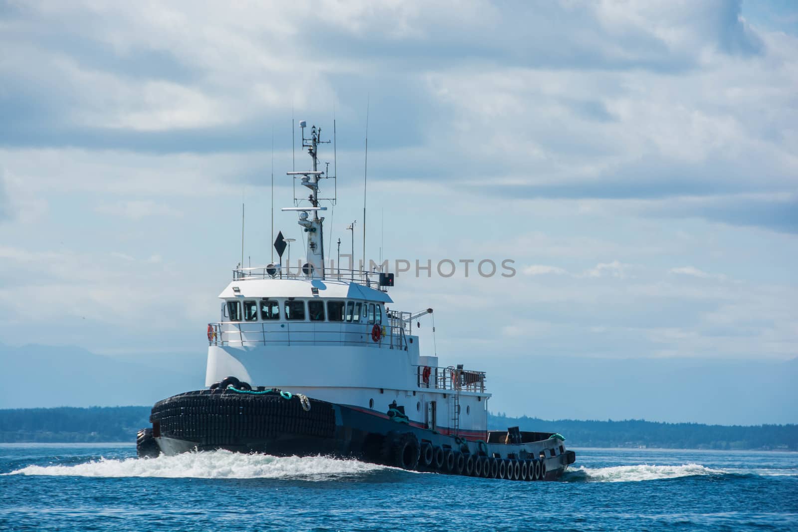 Tug returning from trip north.  with a "bone in her teeth"