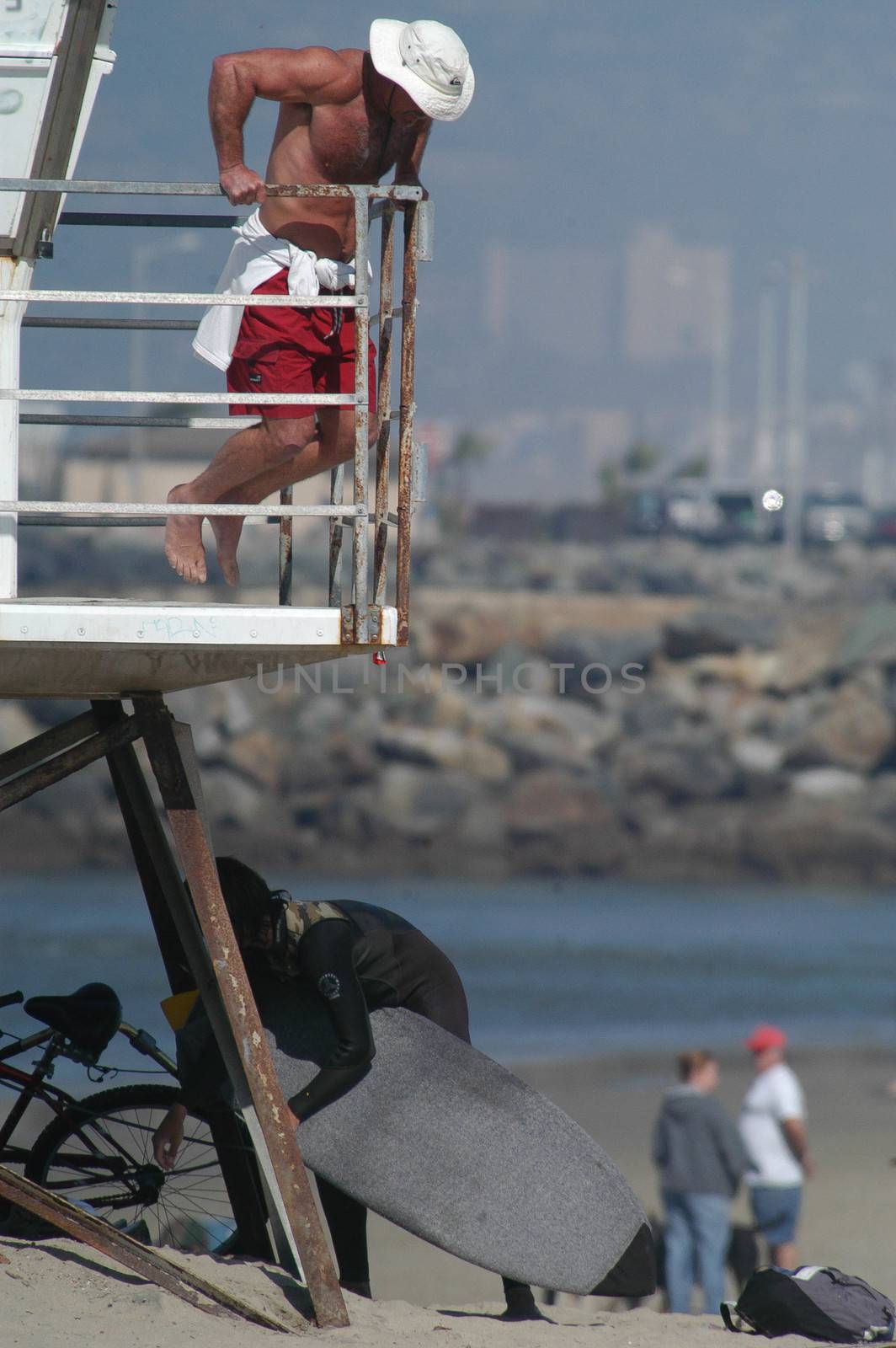 Lifeguard does bar dips on lifegurard stand