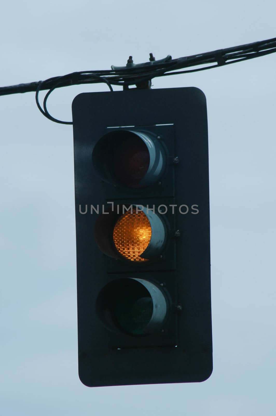 Traffic Light directing motorists and pedestrians to use caution