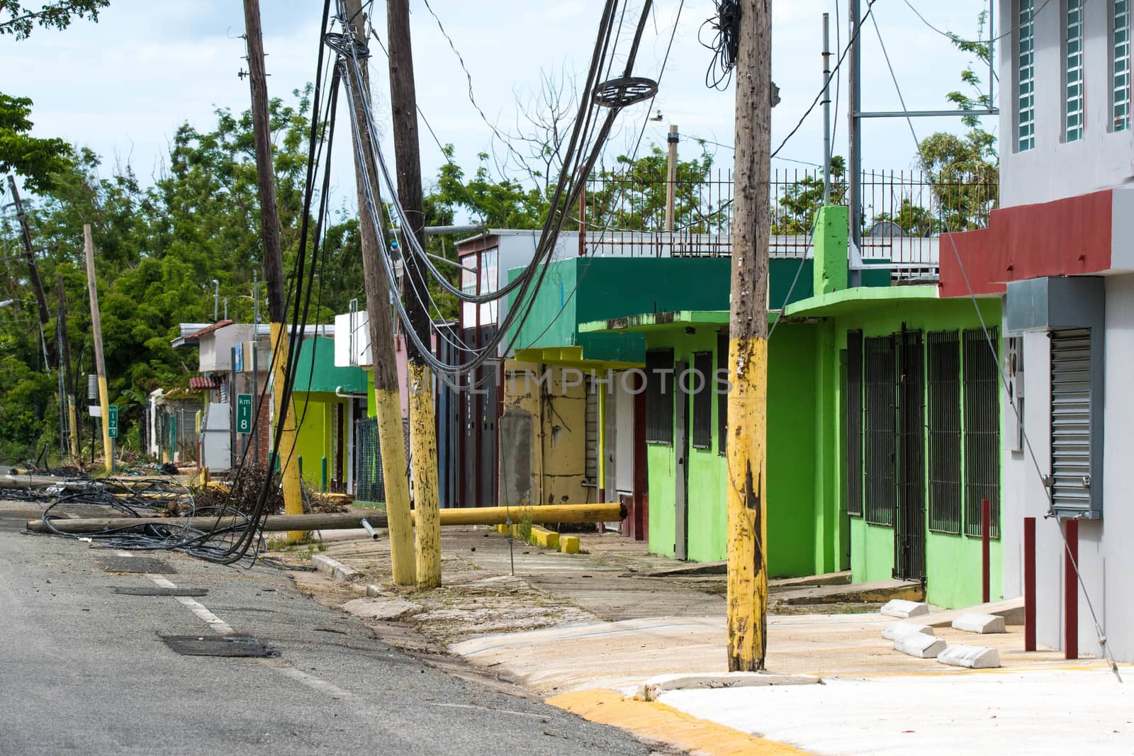 Roadside scene in Rincon, Puerto Rico after Hurricane Marie showing damage to businesses and power lines