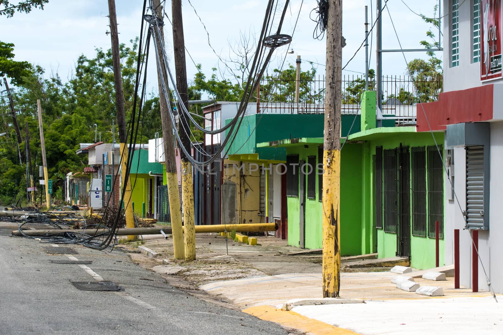 Roadside scene in Rincon, Puerto Rico after Hurricane Marie showing damage to businesses and power lines