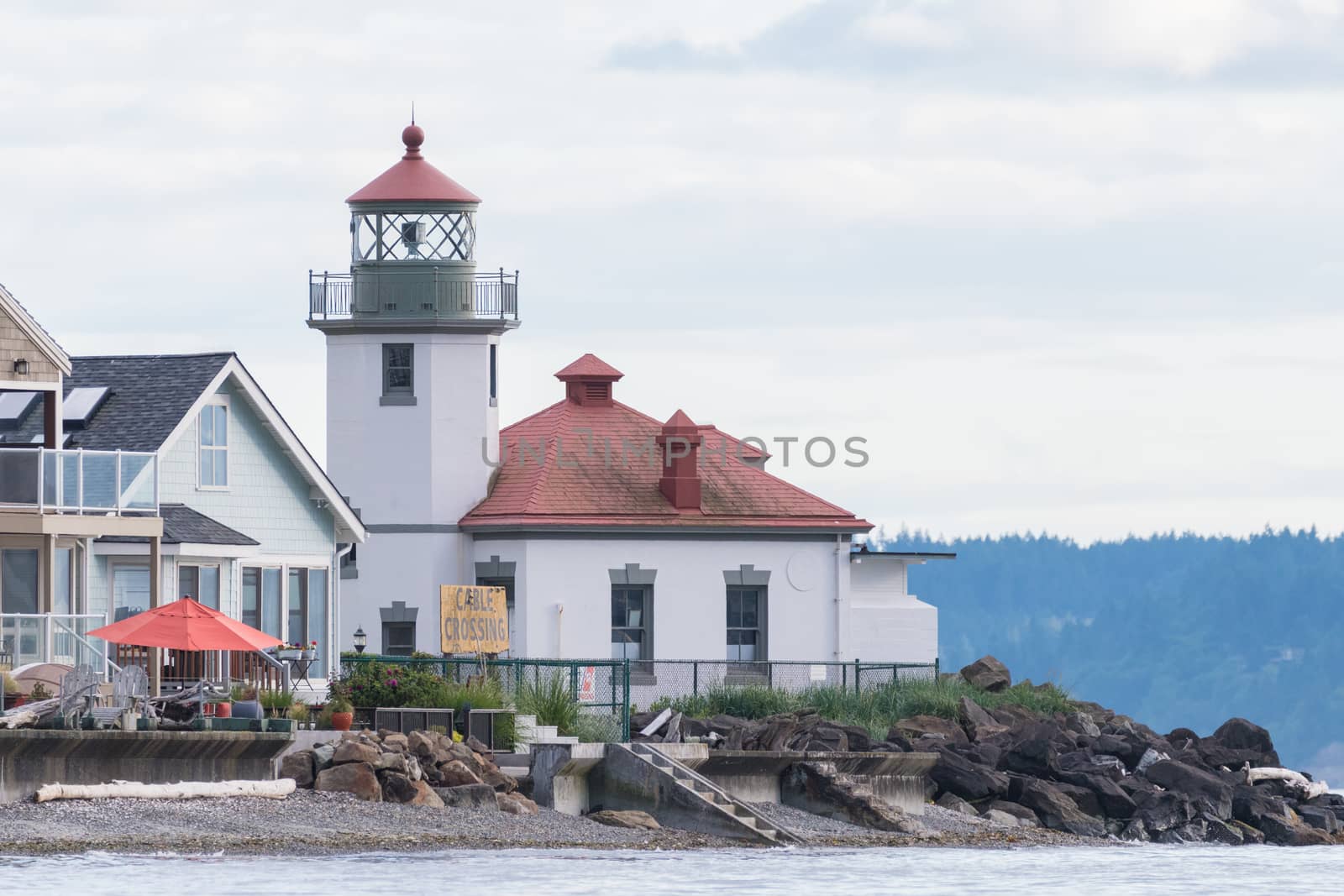 Seattle's Alki Point Lighthouse taken from the water on a flat lit day