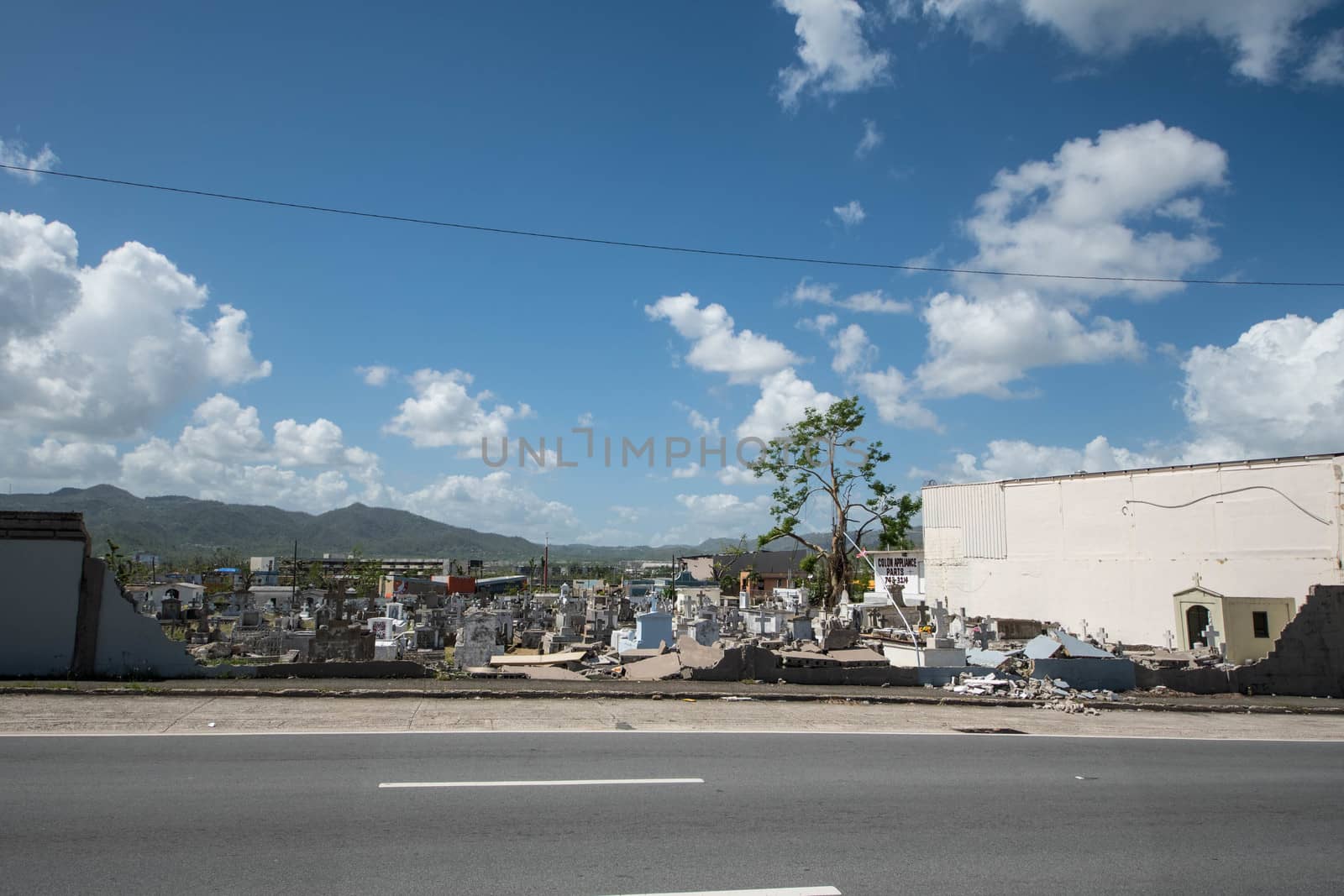 Cemetery wall collapsed from the force of Hurricane Maria's winds.