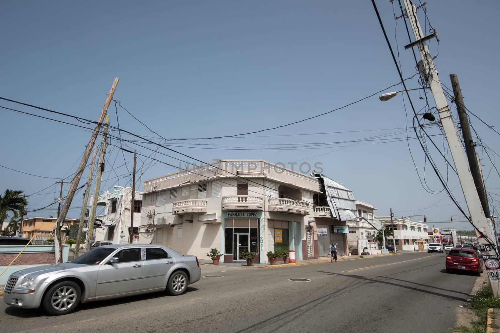 Damage to trees, powerlines, and building in Puerto Rico from Hurricane Maria, Sep 2017