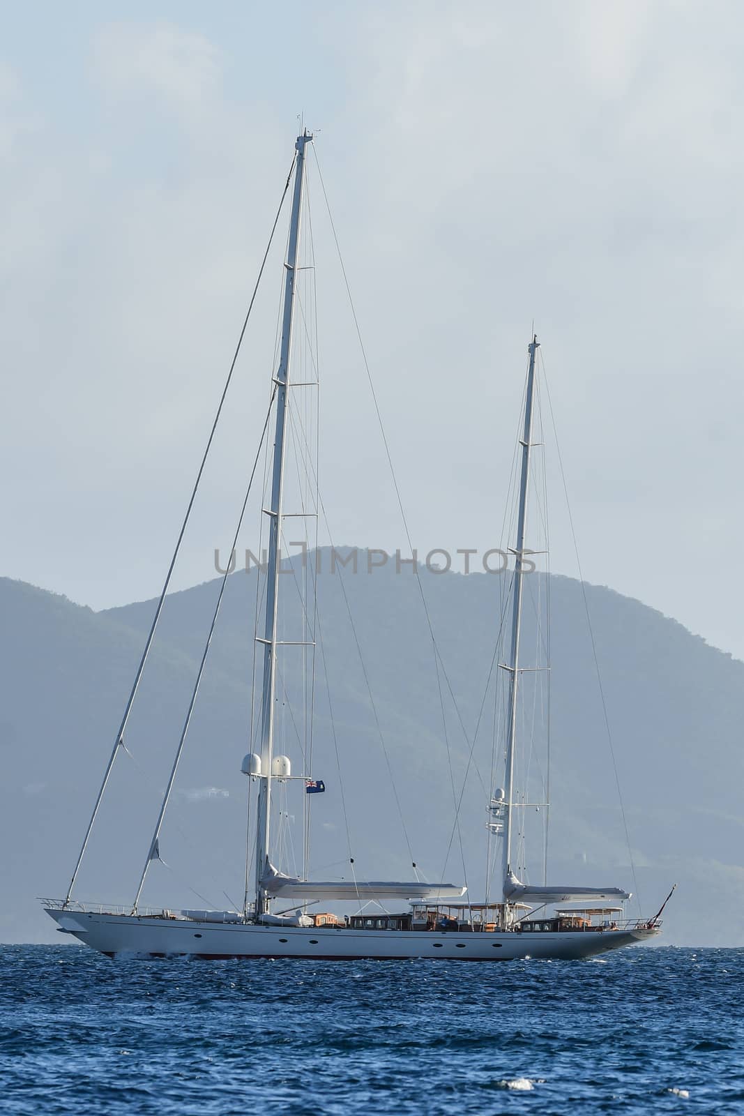 Mega sailing ketch anchored offshore in British Virgin Islands.