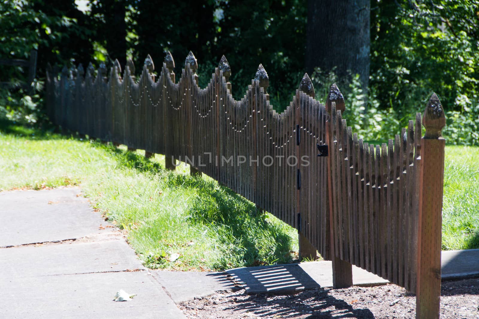 Fence and Sidewalk in Small Town by cestes001