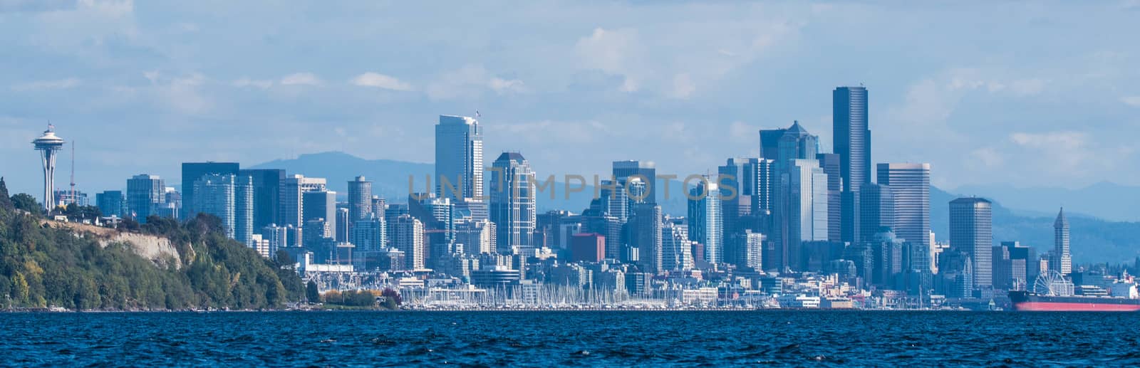 View of Seattle from Magnolia, taken from boat with Magnolia Bluff to the left and Smith Tower to the right