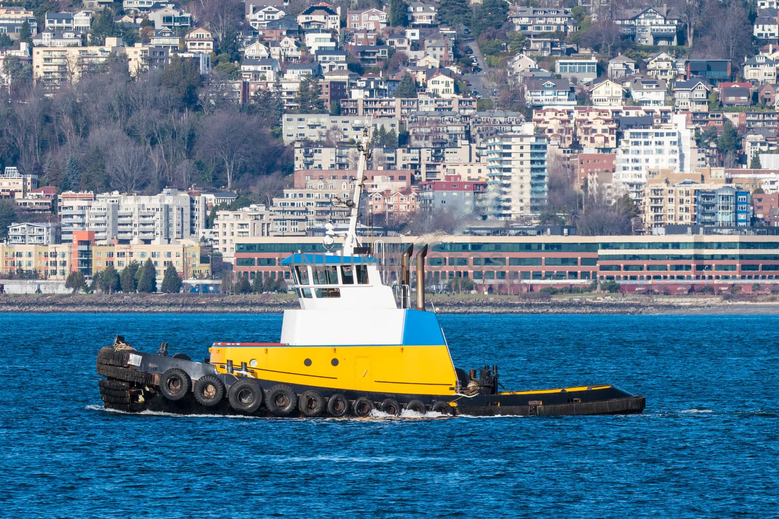 Tug plying the waters of Seattle's Elliott Bay on the way to pick up a tow.