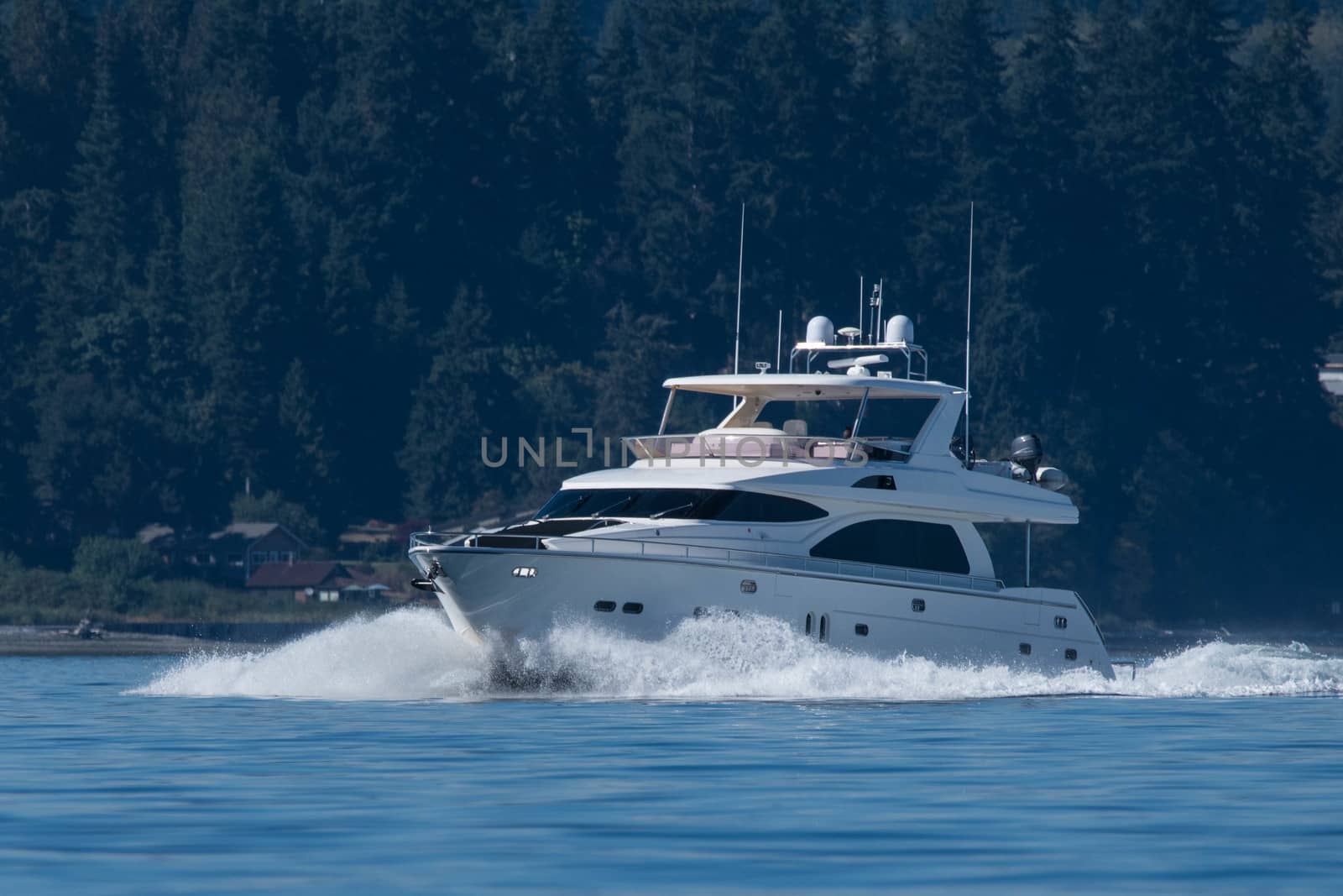 Southbound motor steaming south on Puget Sound with Bainbridge Island in the background.