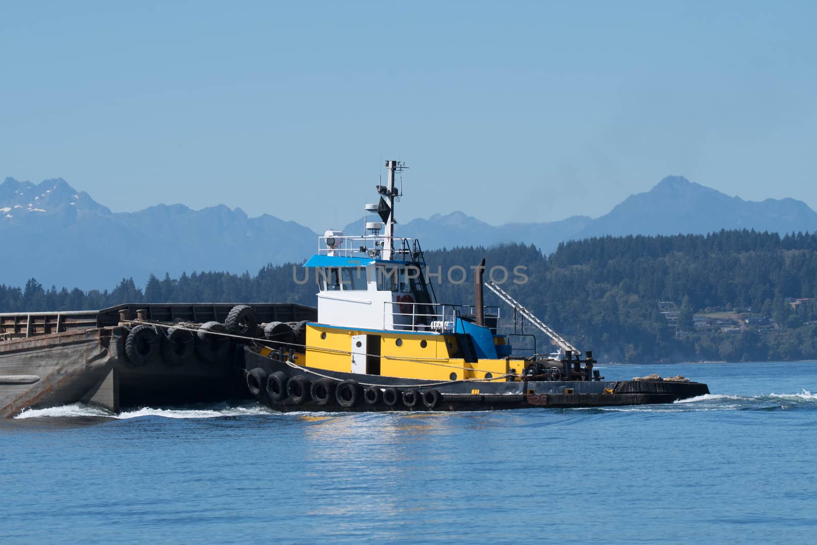 Wasp pushing gravel barge through Shilshole Bay on its way to Tacoma