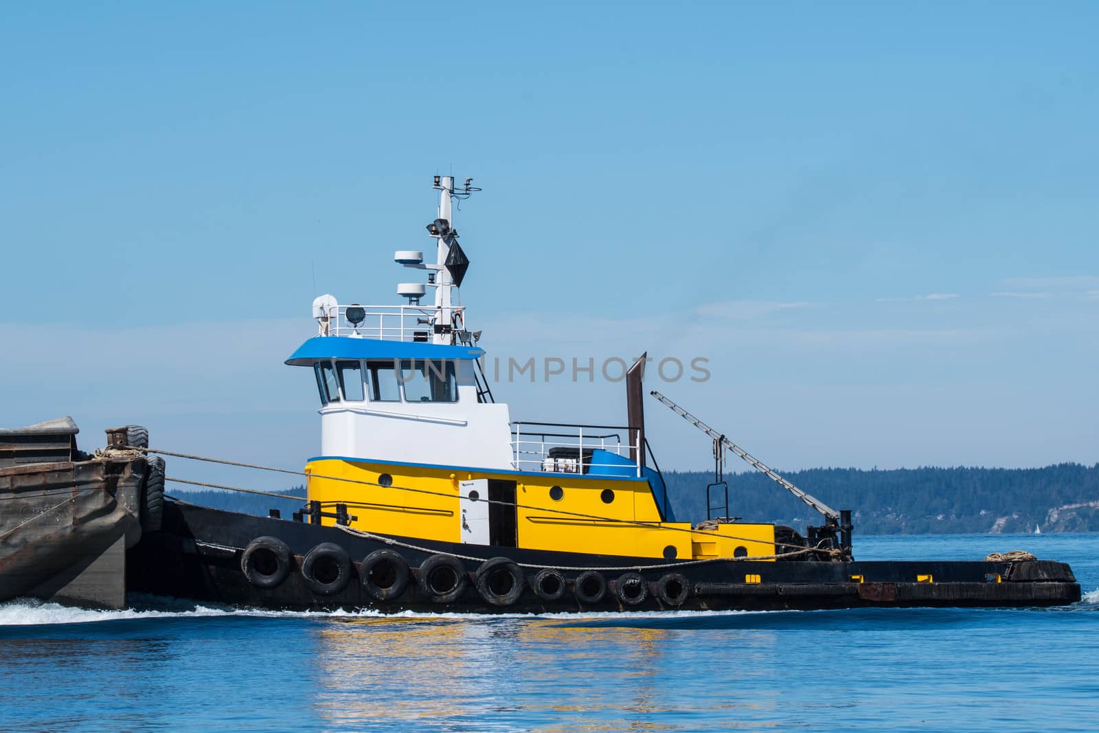 Tug Wasp pushing a barge by cestes001