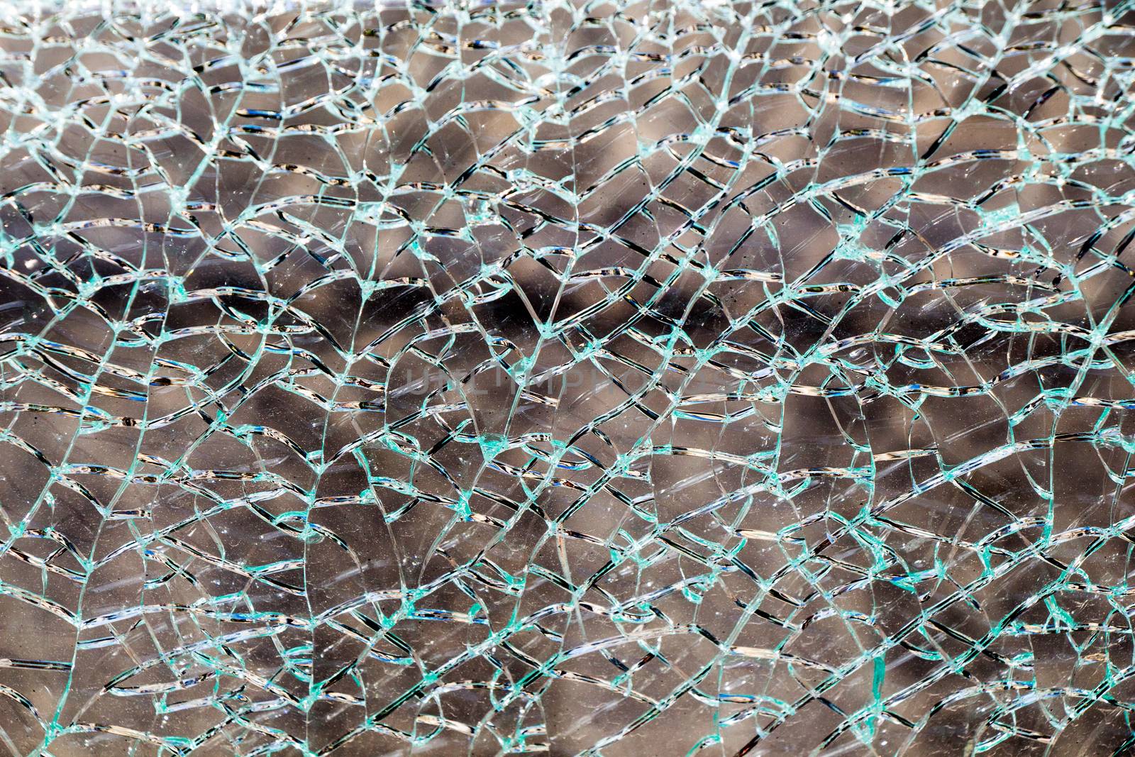 Shattered glass with cracks as background by berkay