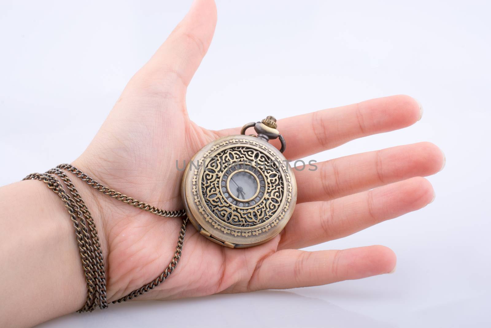 Retro style classic pocket watch in hand by berkay
