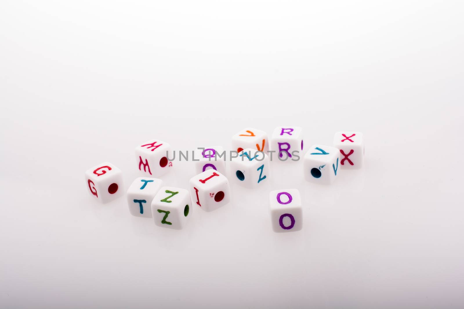 Colorful alphabet letter cubes on a white background