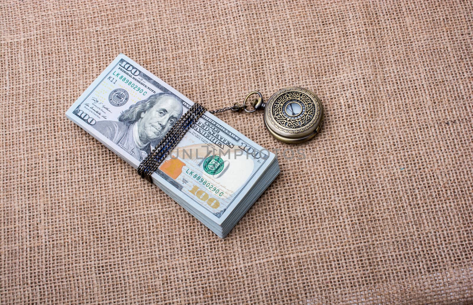 Pocket watch wrapped around US dollar by berkay