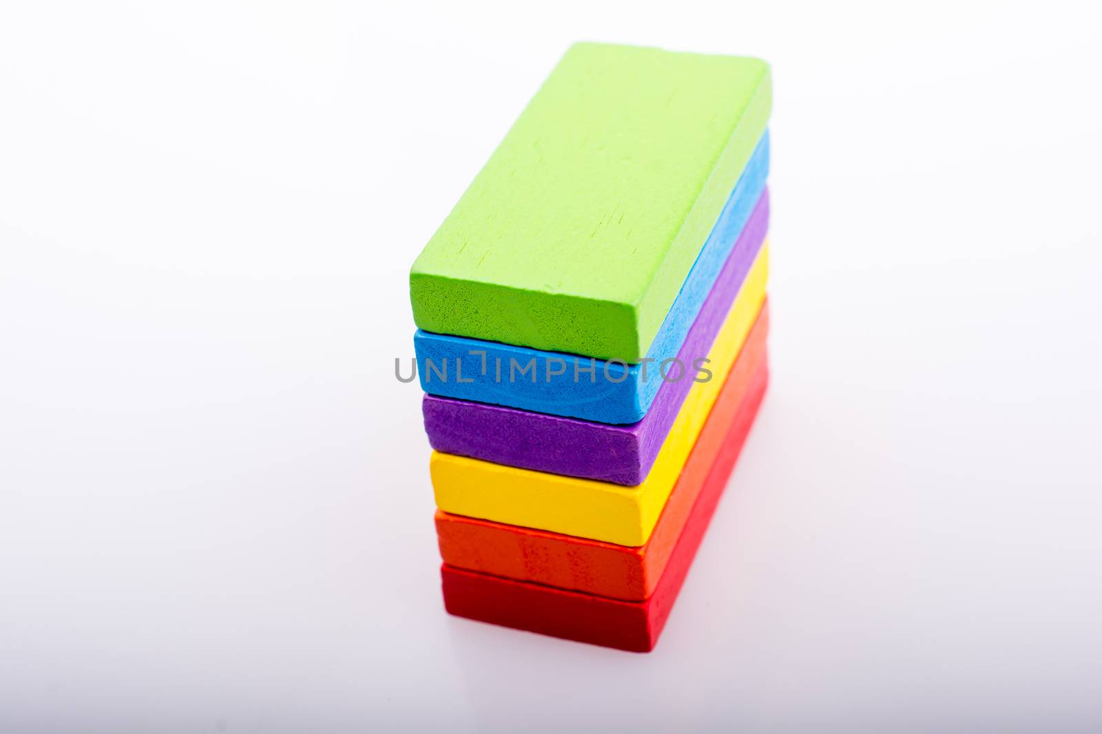 Colorful Domino Blocks in a line on a white background