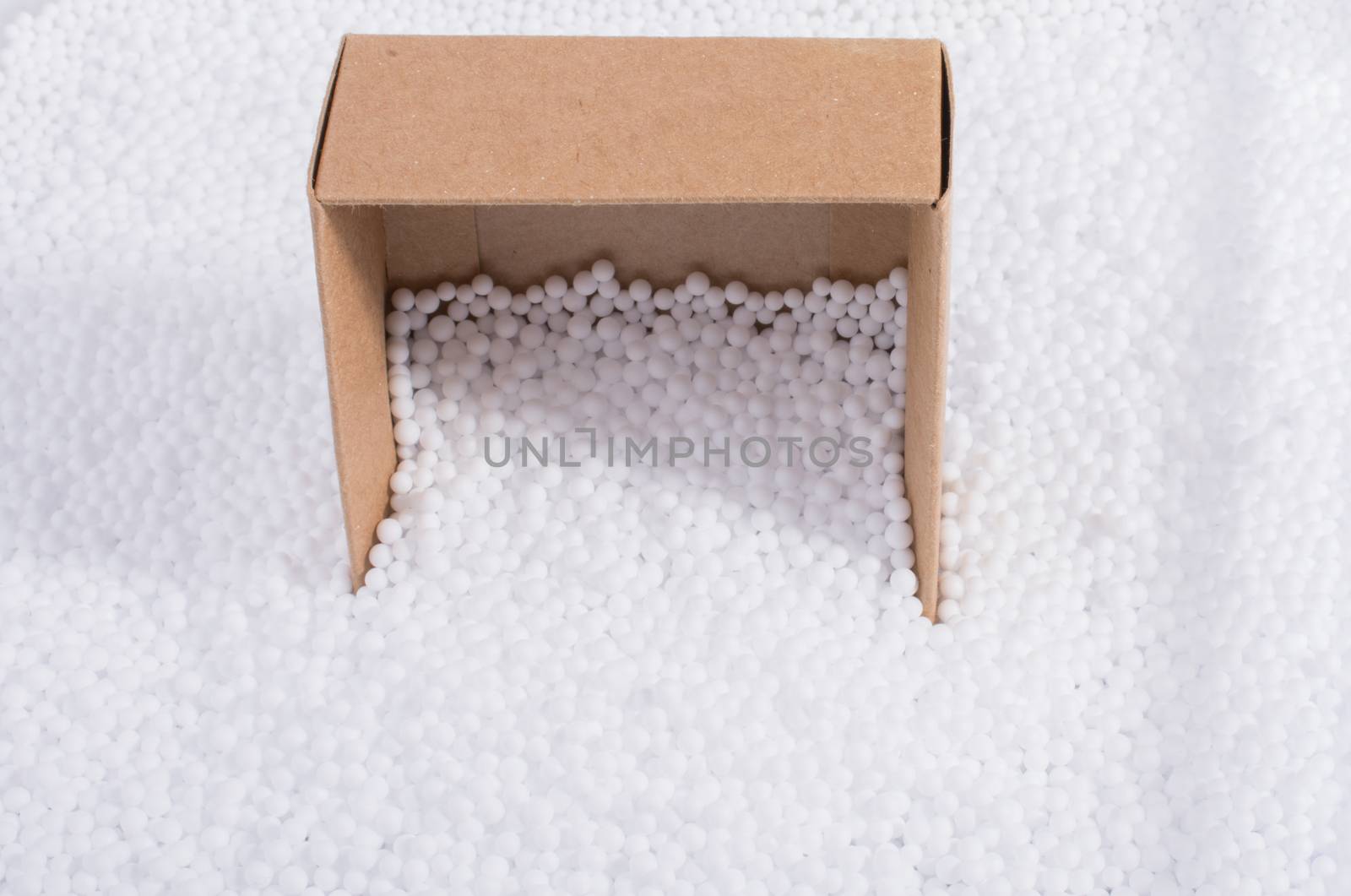Box on little  white polystyrene foam balls