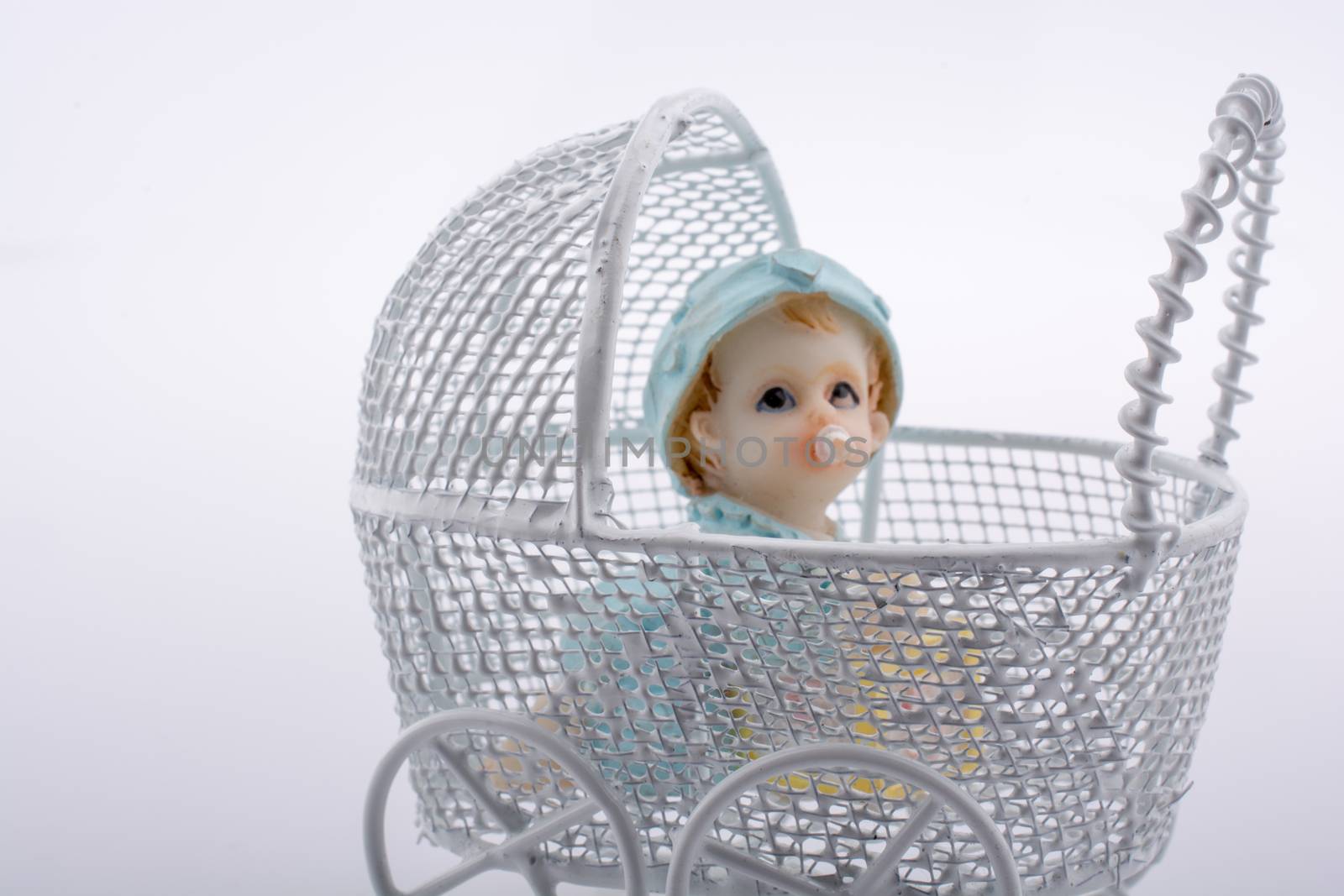 Little baby doll in baby  carriage by berkay