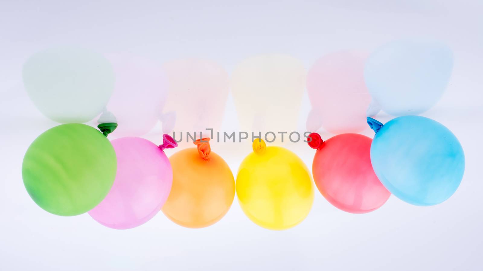 Colorful small baloons on a white background