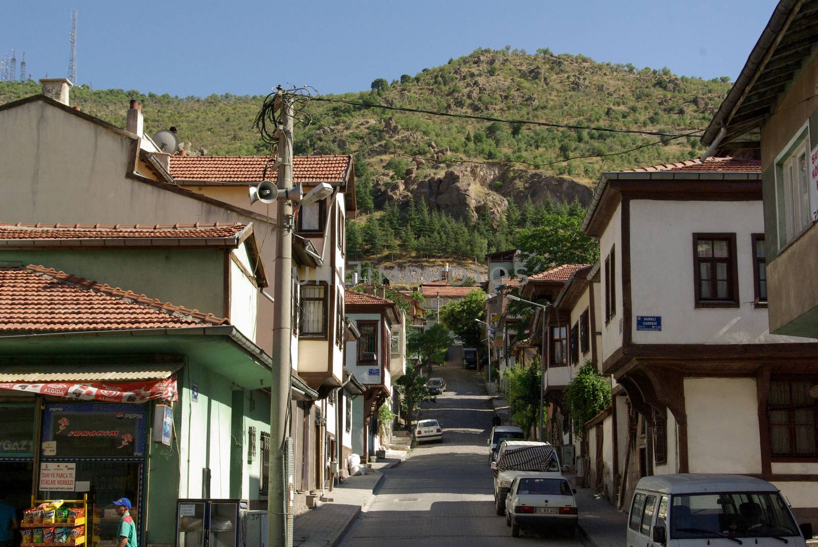Old styled wooden Turkish houses in the street by berkay