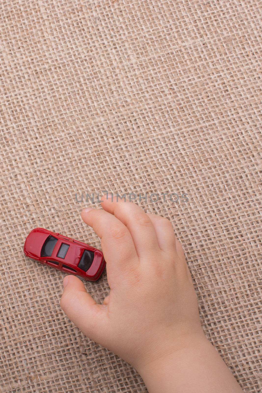 Toy car as a transportation devices in hand  by berkay