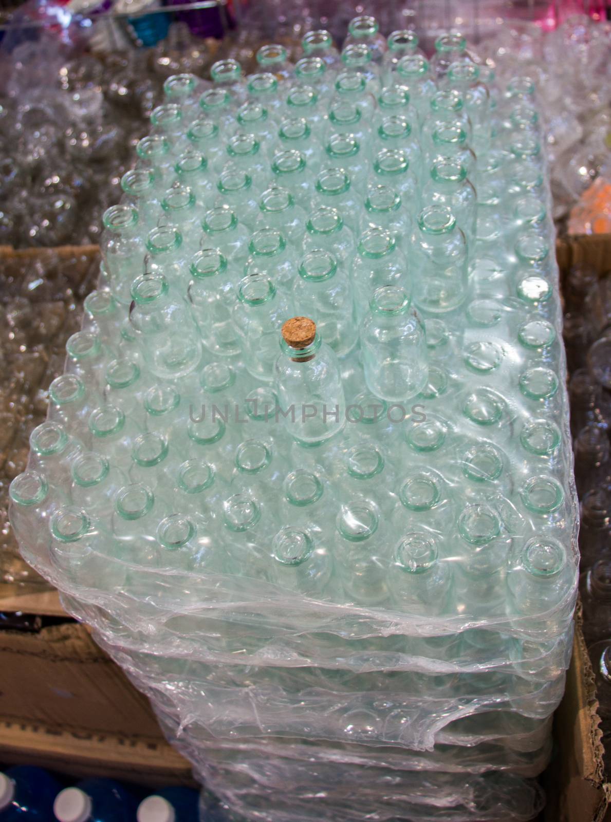  Set of Empty little transparent bottles in a box  by berkay