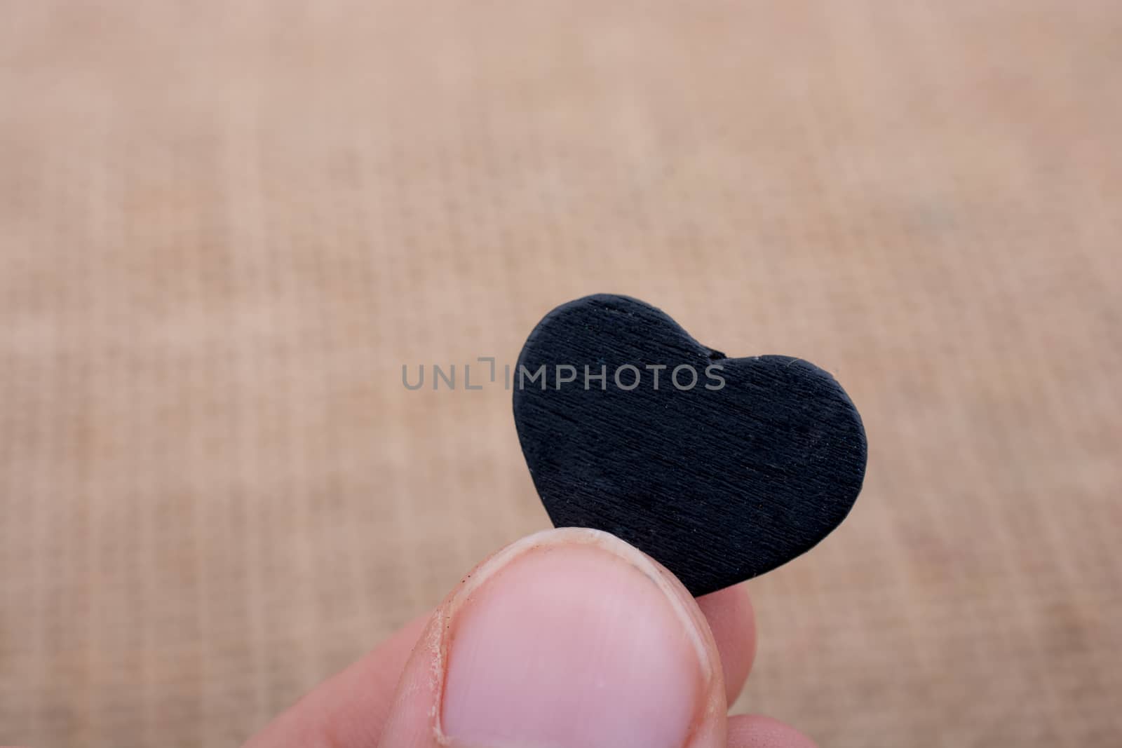 Heart shaped object in hand by berkay