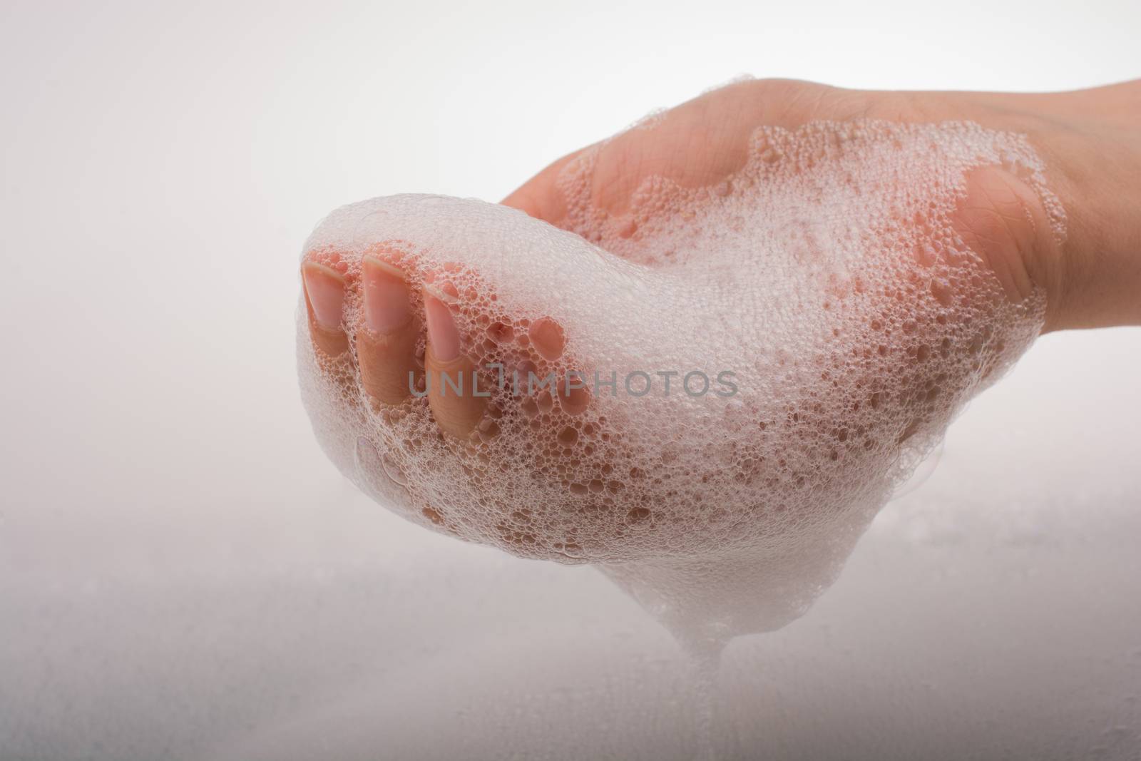 Child washing hands  in foam by berkay