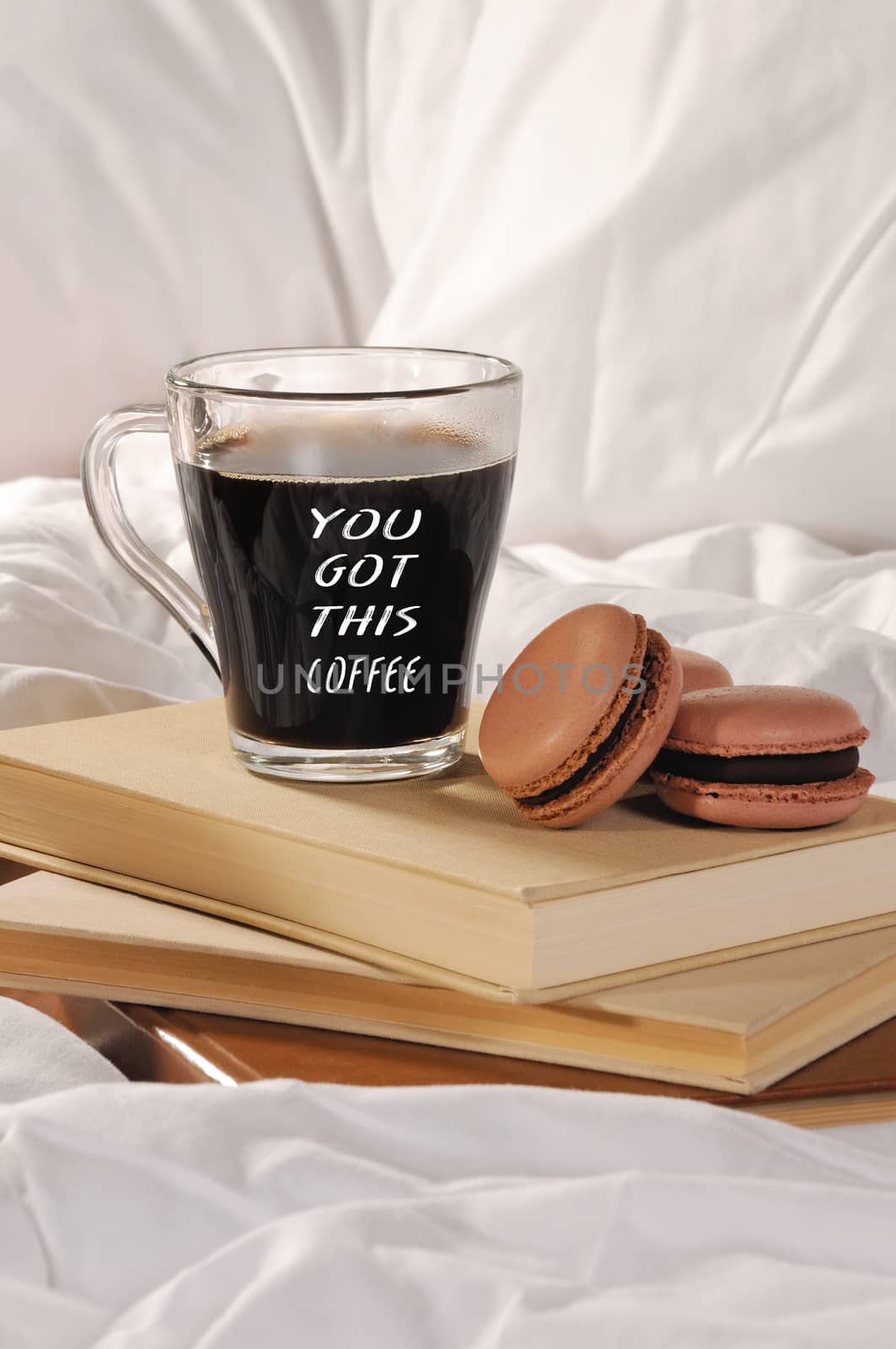 Morning cup of coffee with chocolate cakes Macaroons, on a pile of books in bed.
You got this coffee.
