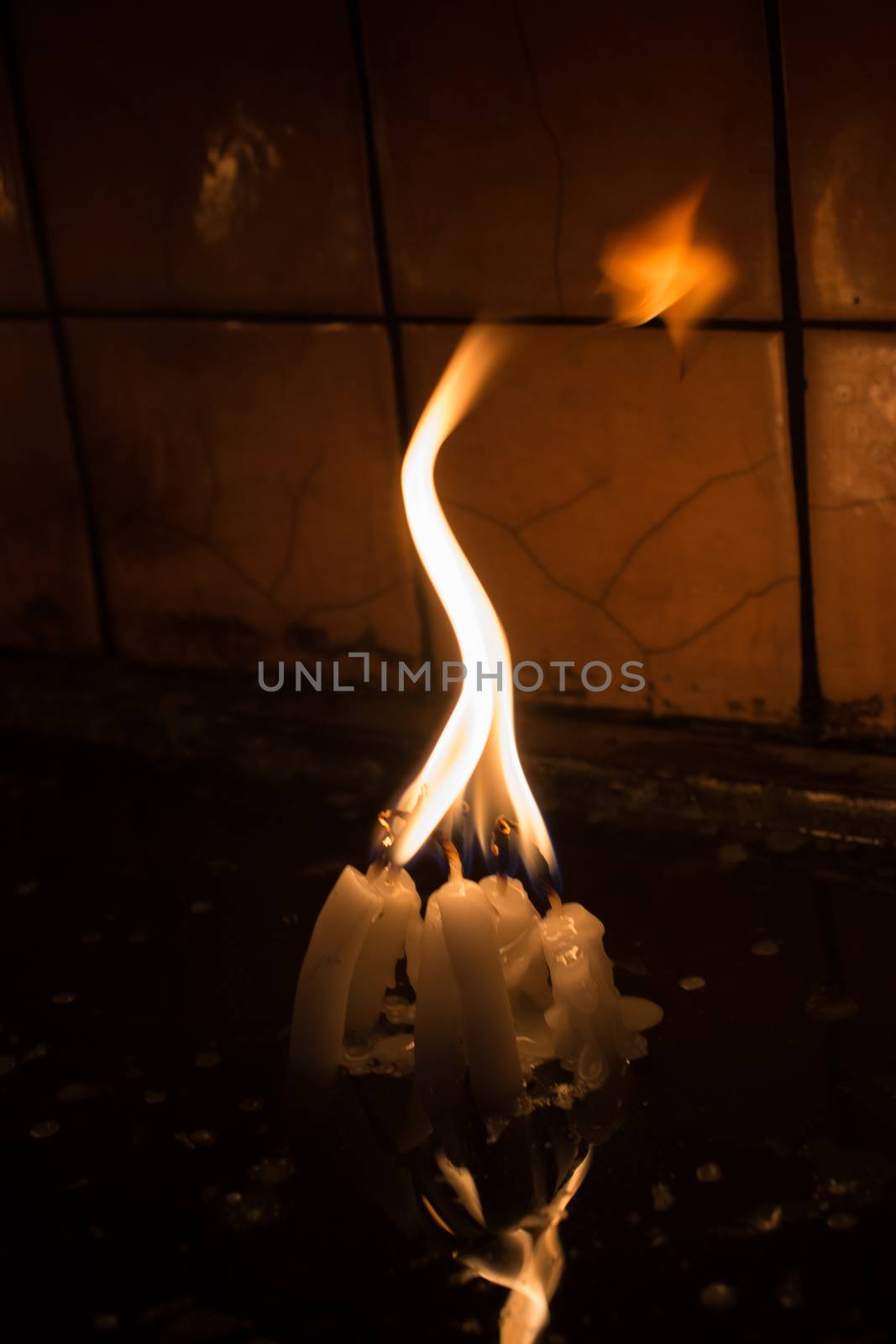 Burning candles with candle light in the dark