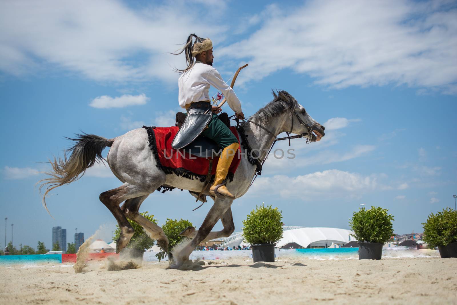 Ottoman horseman in his ethnic clothes riding on his horse