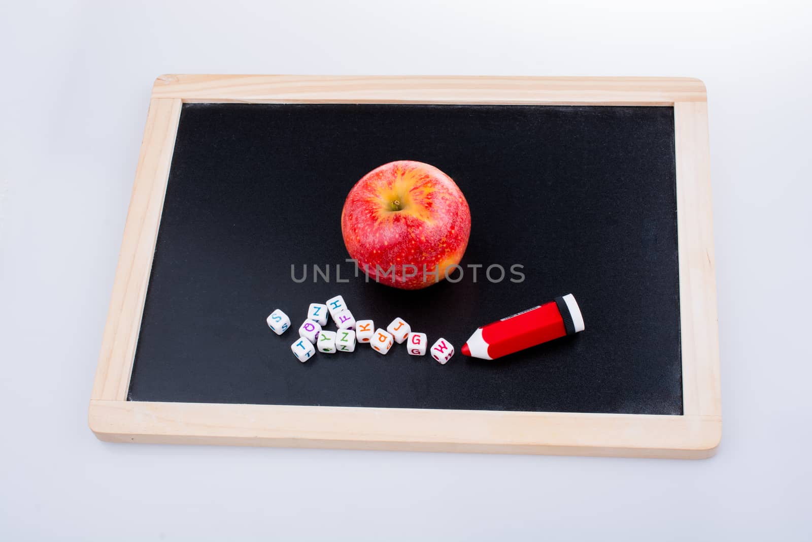 Back to school theme with a red apple and board