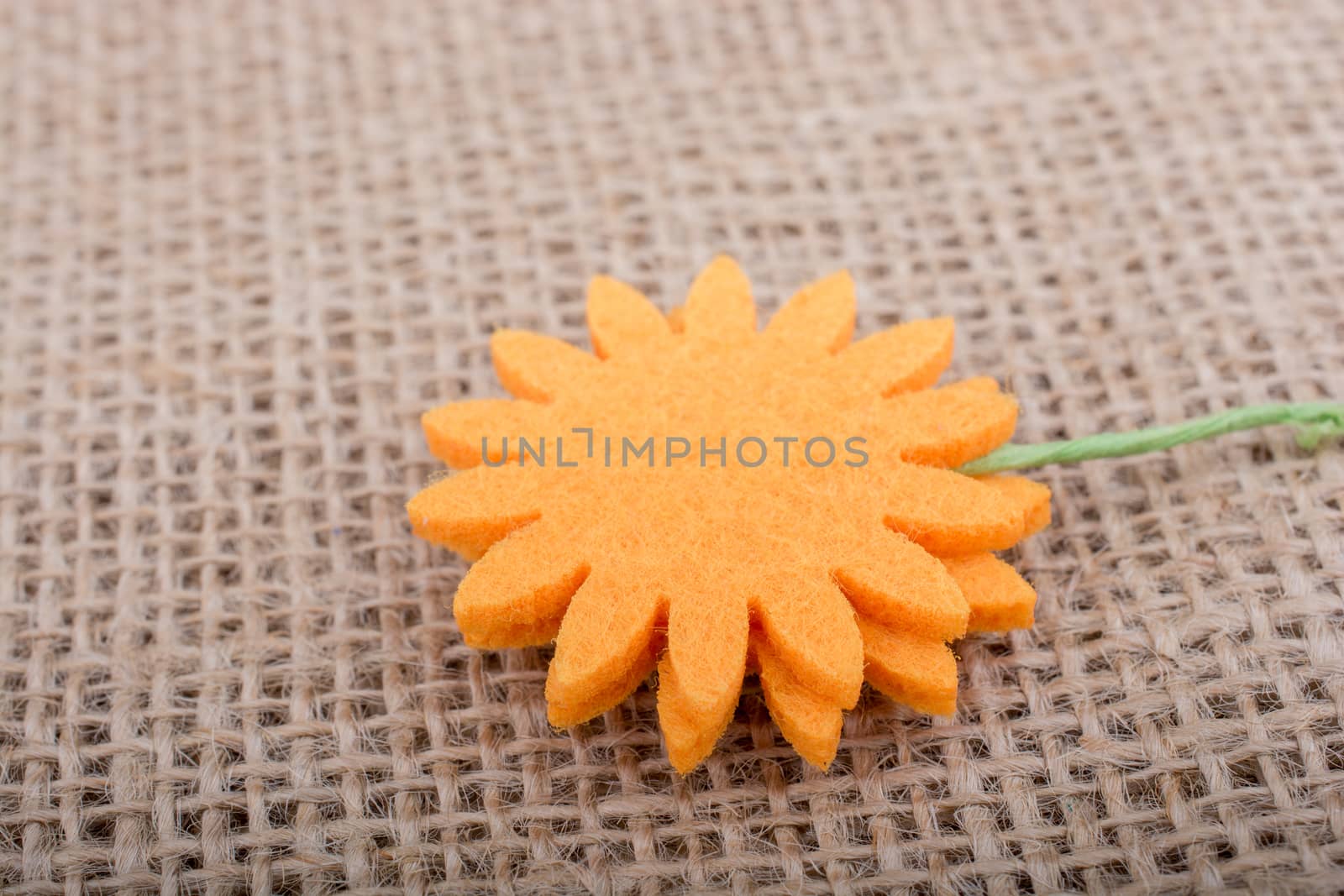 Fake flower placed on brown background