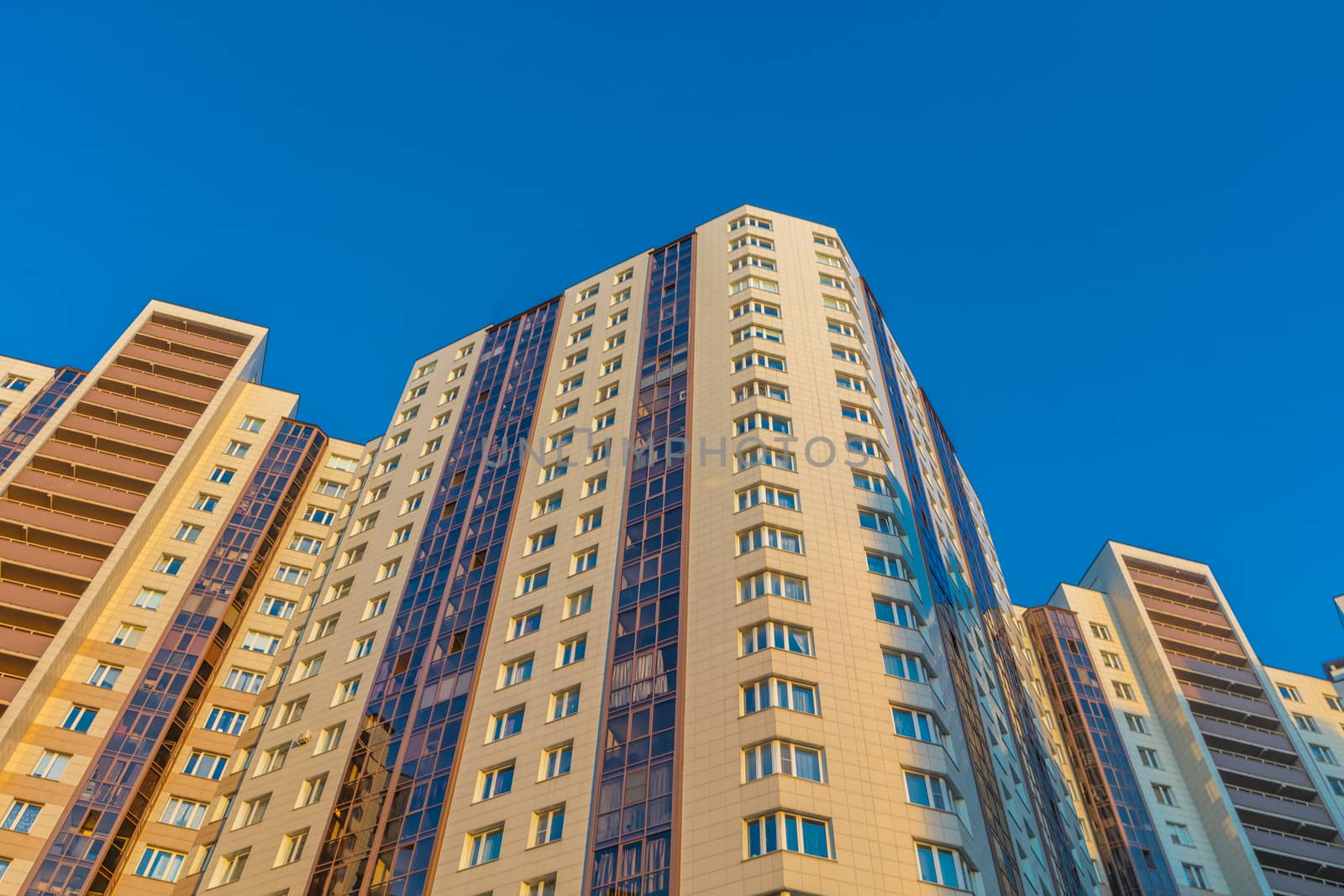 Modern building exterior low angle view with blue sky