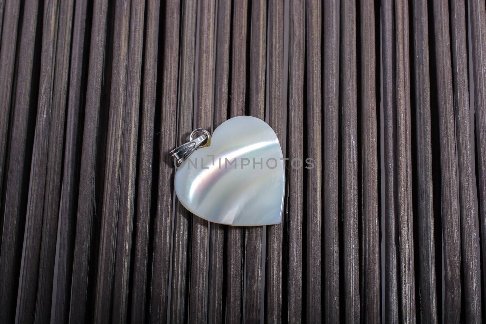 Heart shaped icon placed on a straw mat