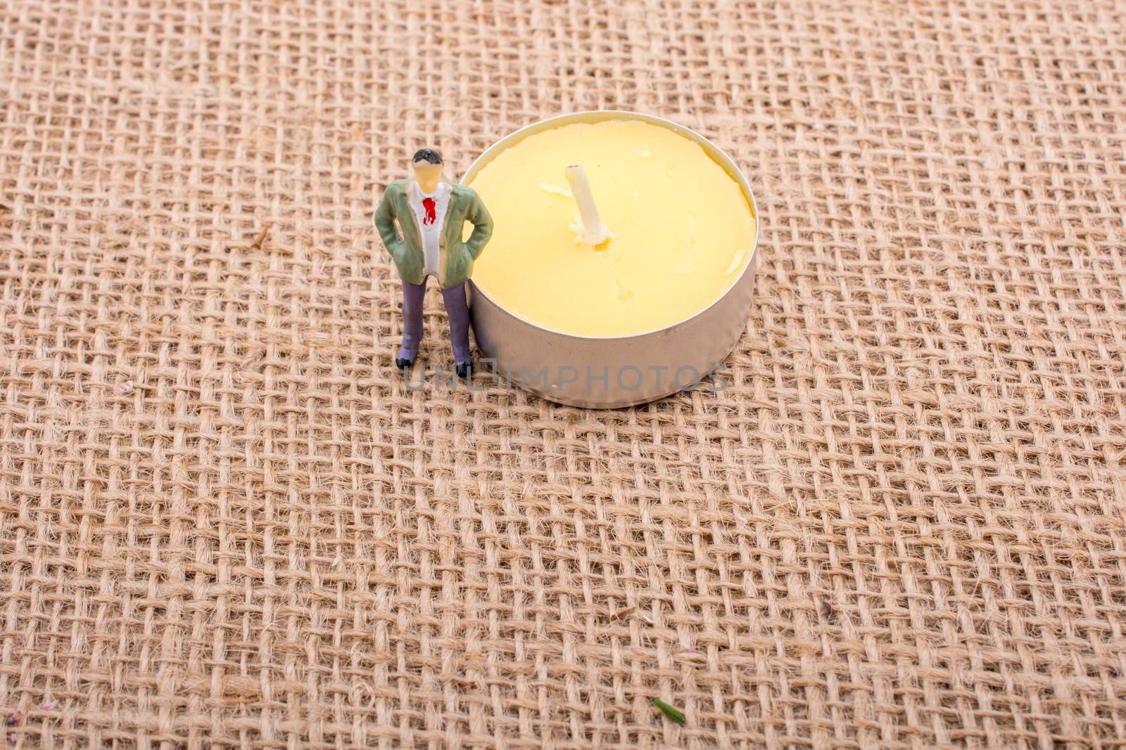 Figurine man standing on a linen canvas