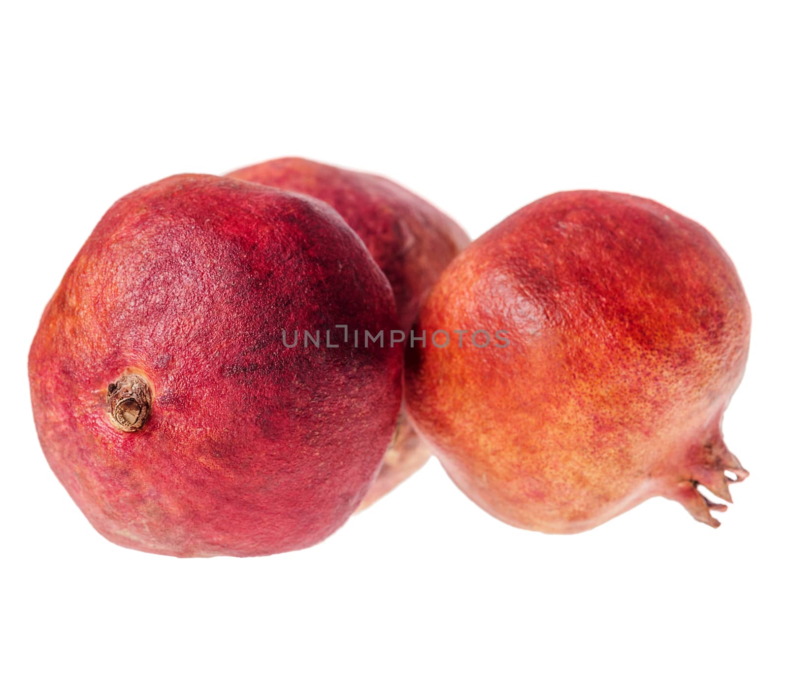 Three ripe jusy pomegranate isolated on white background