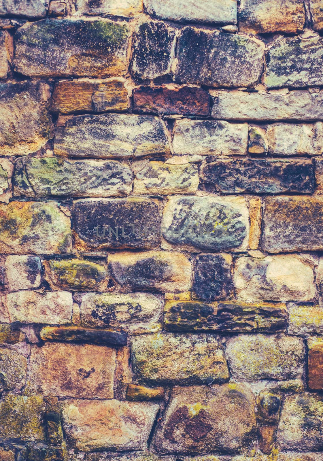 Abstract Background Detail Of A Crumbling Rustic Old Vintage Stone Wall